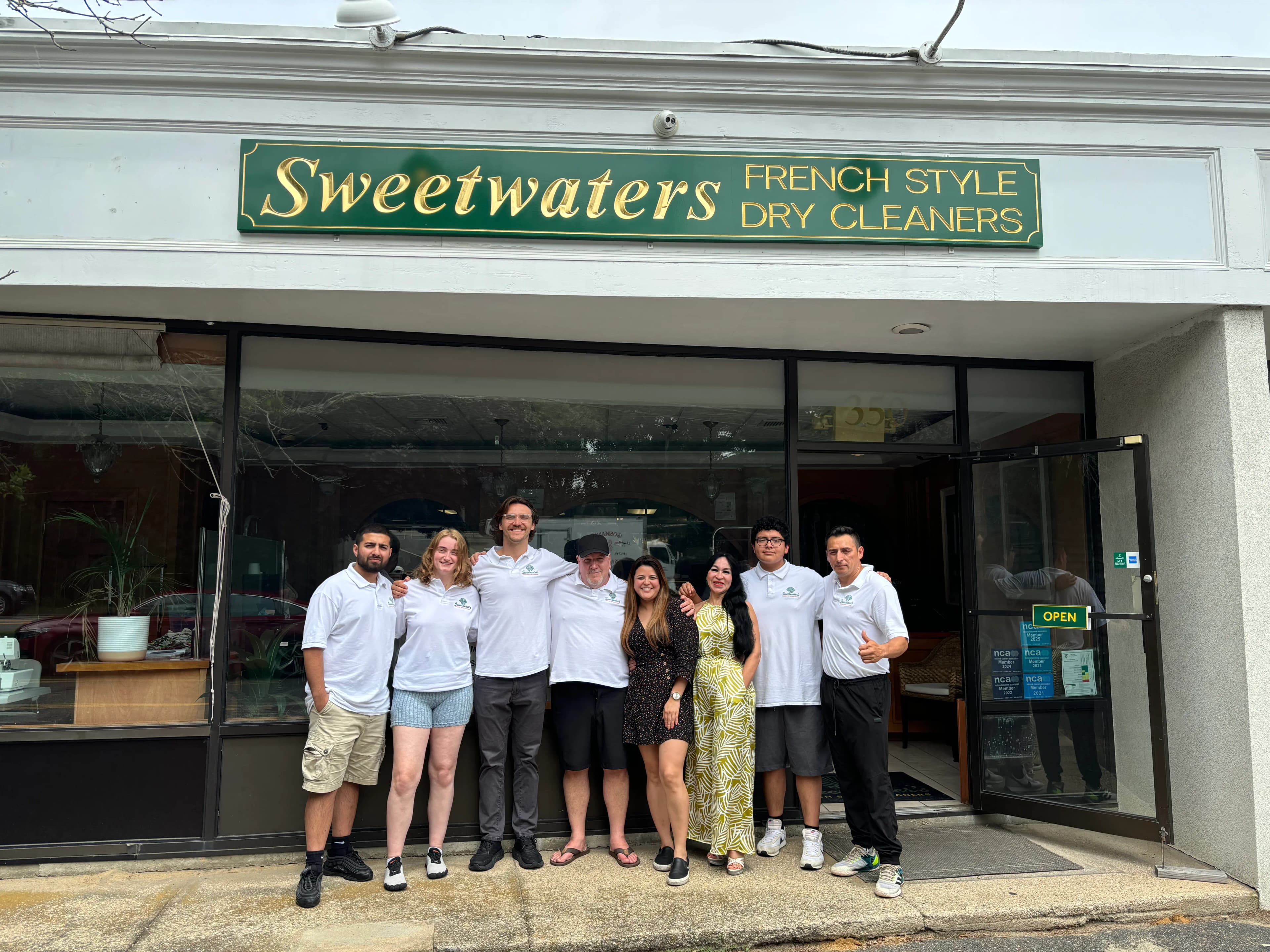Garment care team outside Sweetwater's Cleaners Wainscott NY | locally owned Hamptons dry cleaner since 2004