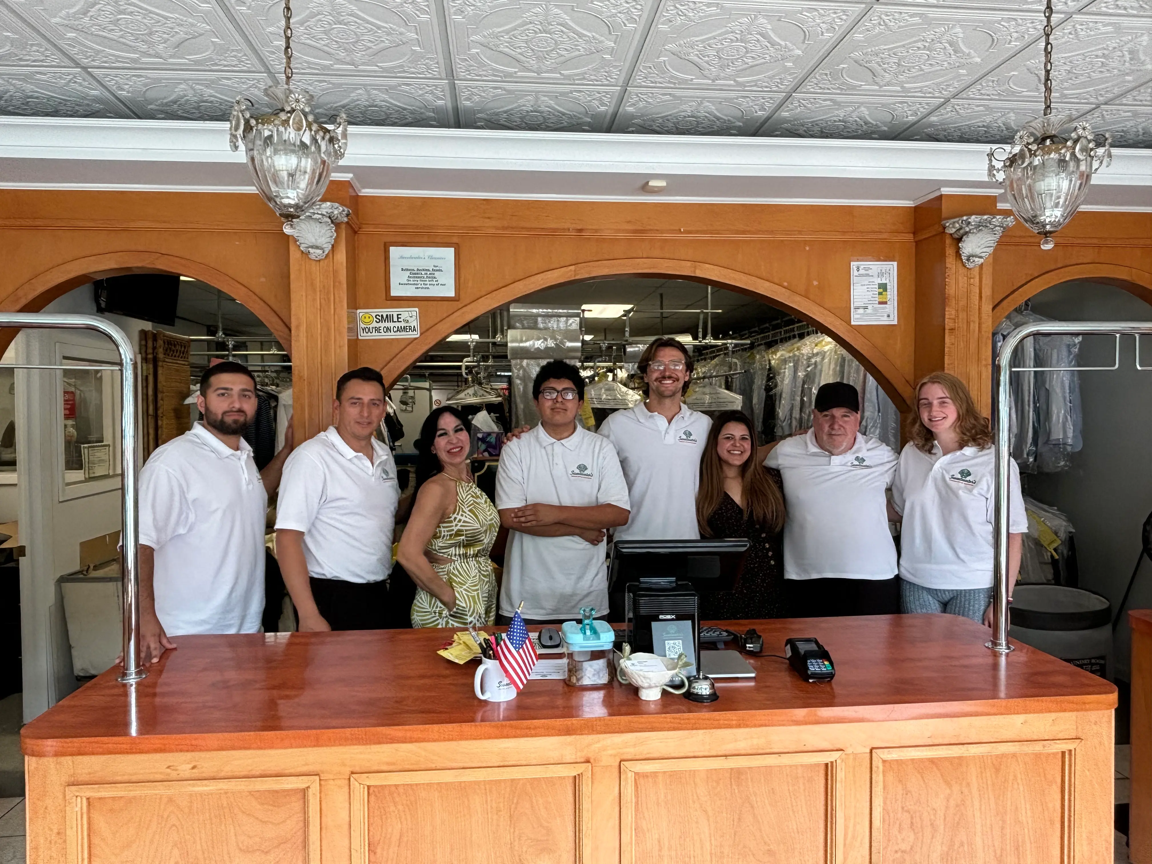 Inside Sweetwater's Cleaners Wainscott | dry cleaning counter and garment finishing area