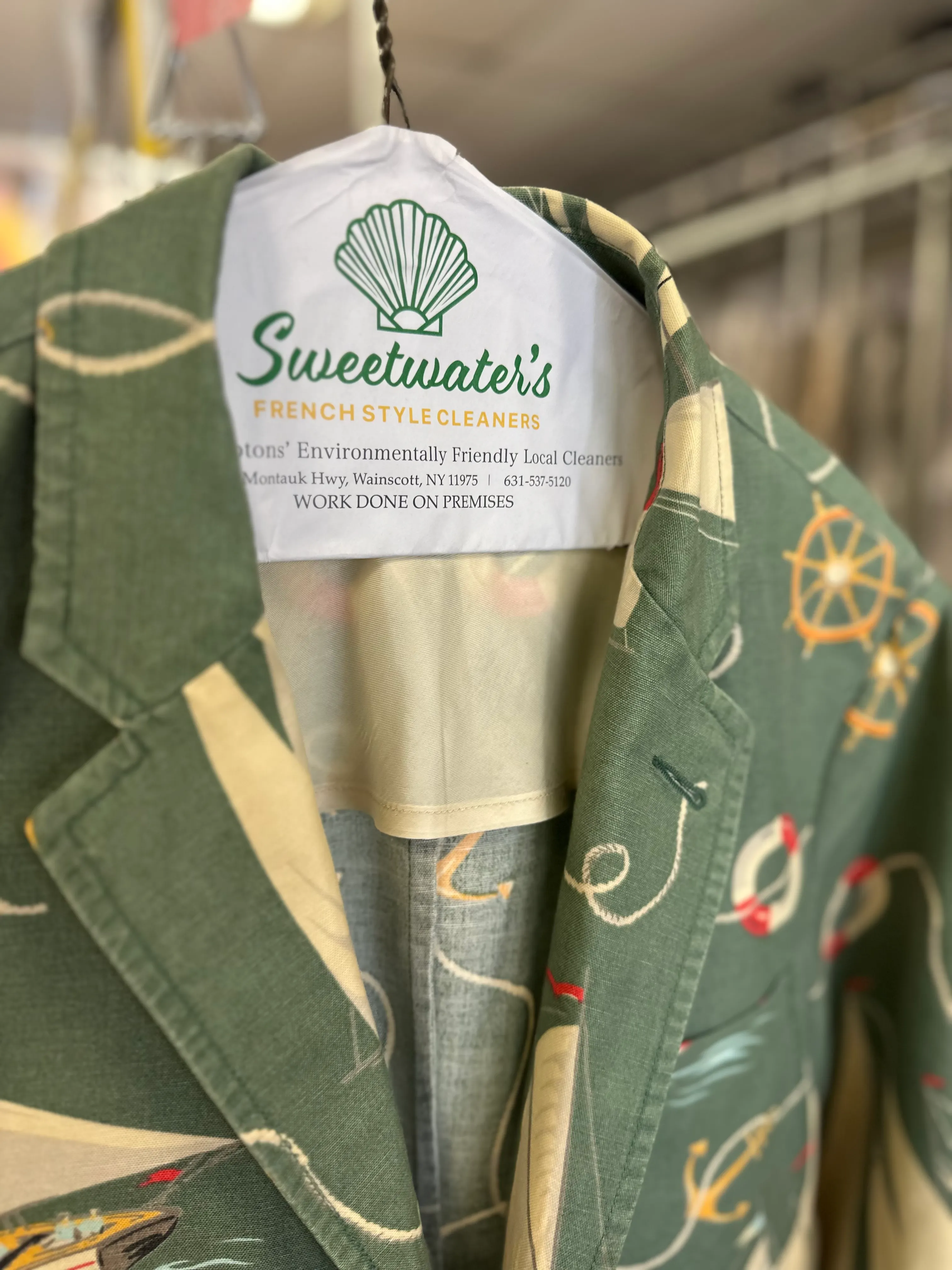 Garments on finishing rack at Sweetwater's Cleaners Wainscott | French style dry cleaning Hamptons